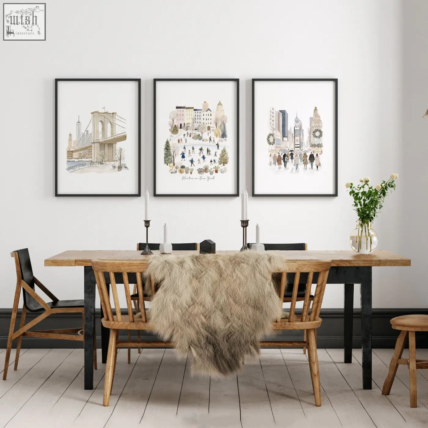 Three framed beige pastel watercolor prints of new york city hang as large dining room wall art above wooden table