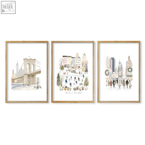 Set of three large dining room wall art prints featuring beige pastel winter scenes of new york in light wood frames