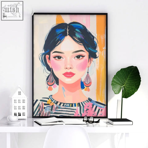 A vibrant wall art print of a woman with dark blue hair and colorful earrings in large framed boho style pictures