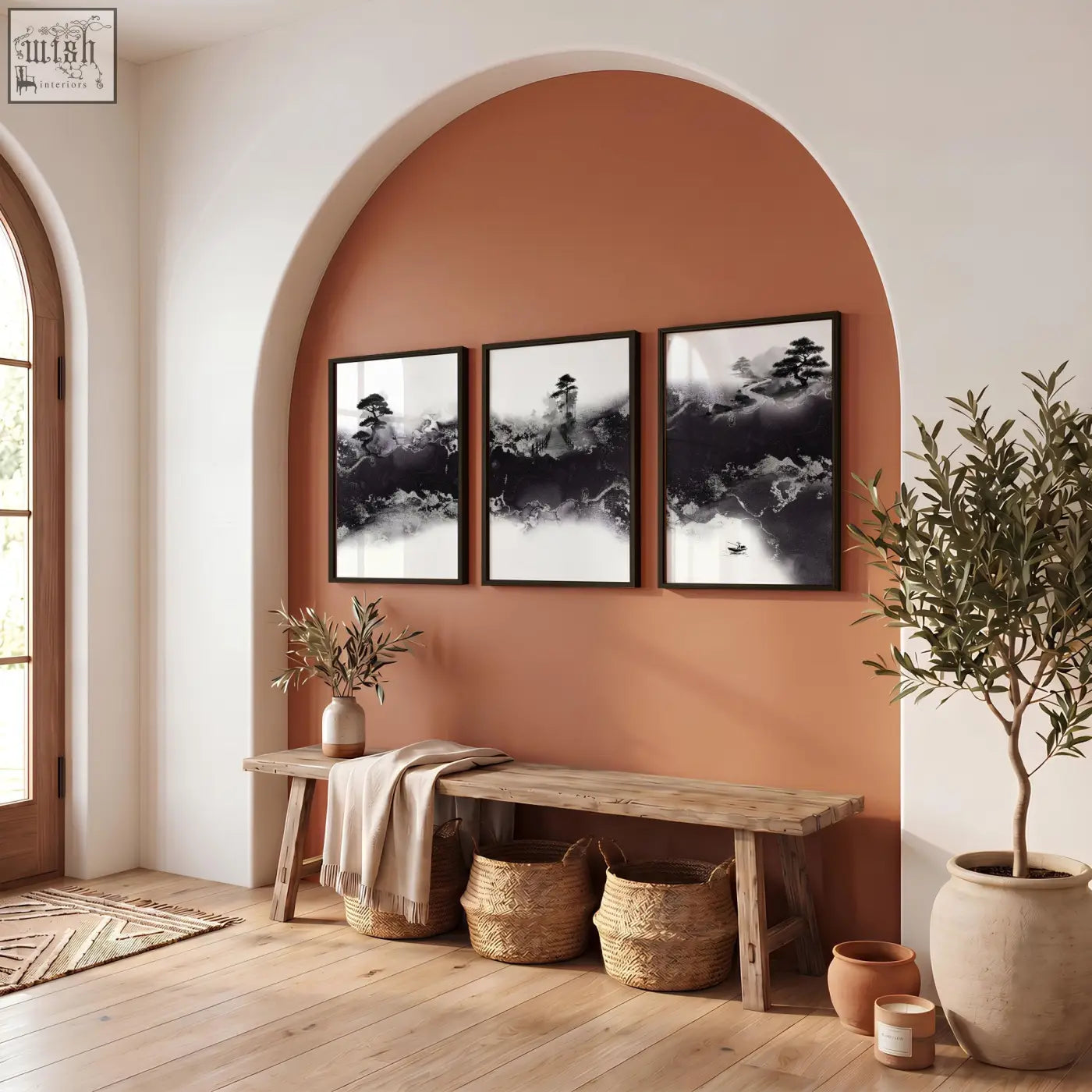Three black and white japanese wall art prints with misty ink landscape and bonsai hang above a rustic wooden bench