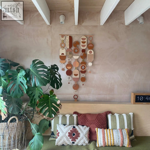 Large modern wall art featuring layered wooden circles in warm terracotta beige and brown tones for minimal home decor