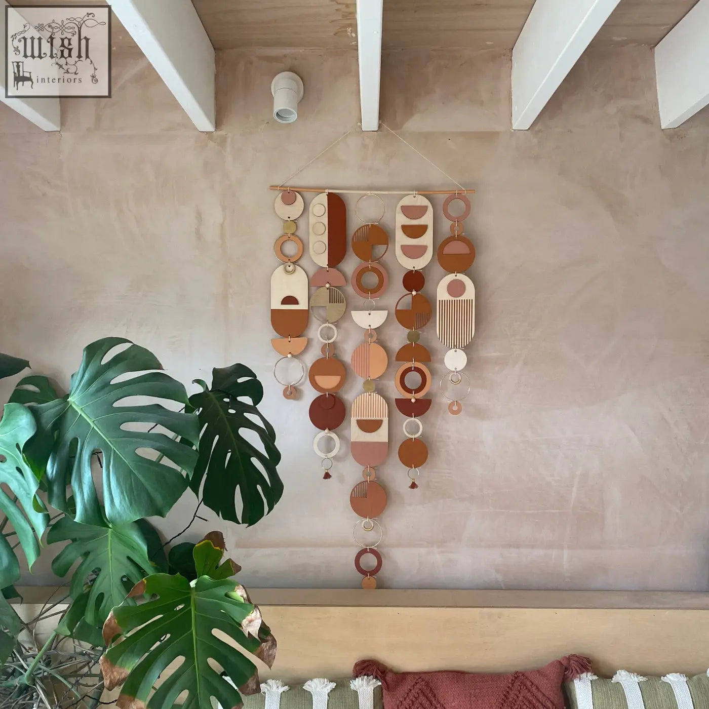 Large modern wall art featuring layered wooden and acrylic geometric shapes in warm terracotta and beige tones