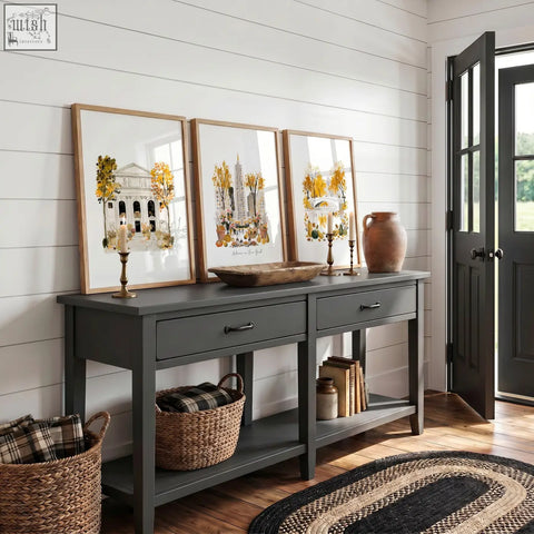 Dark gray wooden console table with two drawers and black metal handles under large new york wall art autumn in york wall set
