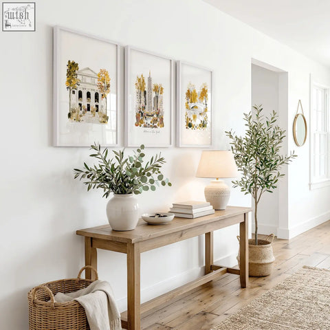 A rustic wooden console table with natural finish under large ochre autumn in new york wall art set of 3 york wall art