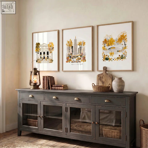 Dark gray wooden sideboard with glass-paneled doors and brass handles below large new york wall art autumn in new york set