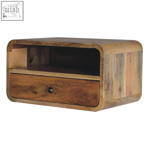 Large oak-ish curve upper slot floating bedside table made of mango wood with a reclaimed wood nightstand look in warm brown tones