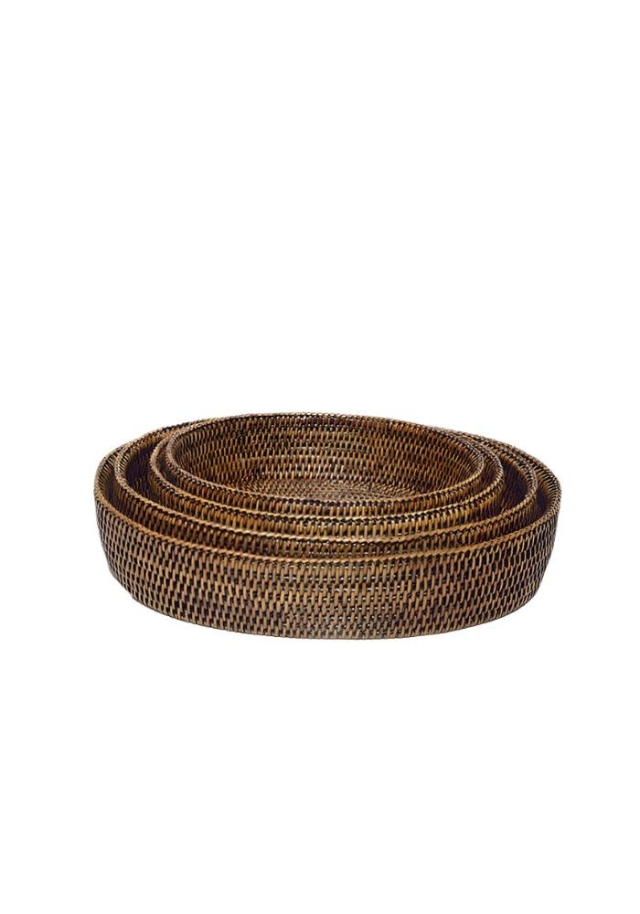 Set of three nested large oval dark brown woven rattan trays with a textured interlaced pattern