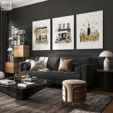 Dark gray upholstered sofa with beige and taupe pillows under autumn in new york living room wall art set of 3