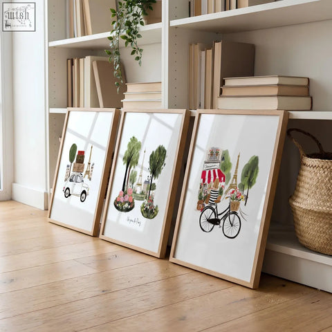 Three light wood framed parisian watercolor illustrations featuring eiffel tower travel wall art for living room decor
