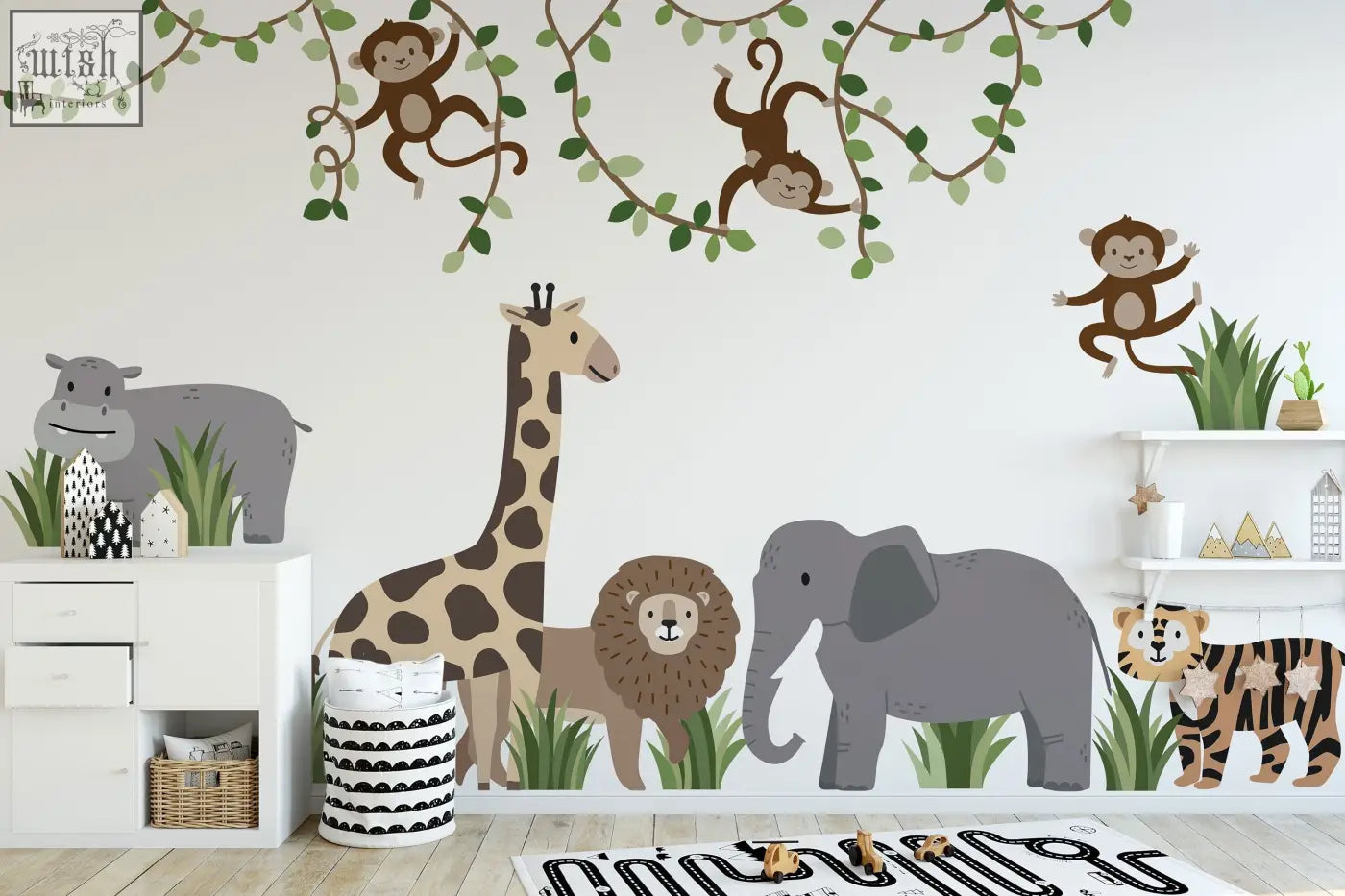A charming safari-themed wall decals set with large safari animals and monkey wall decals in soft earth tones for nursery walls