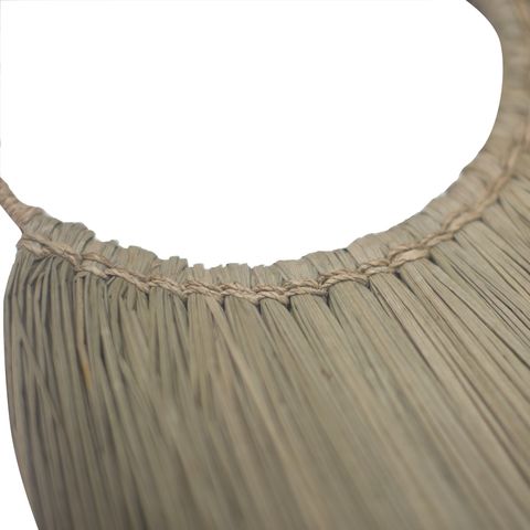 Beige pleated fabric neckline with gathered stitching detail on large natural seagrass fan wall decor