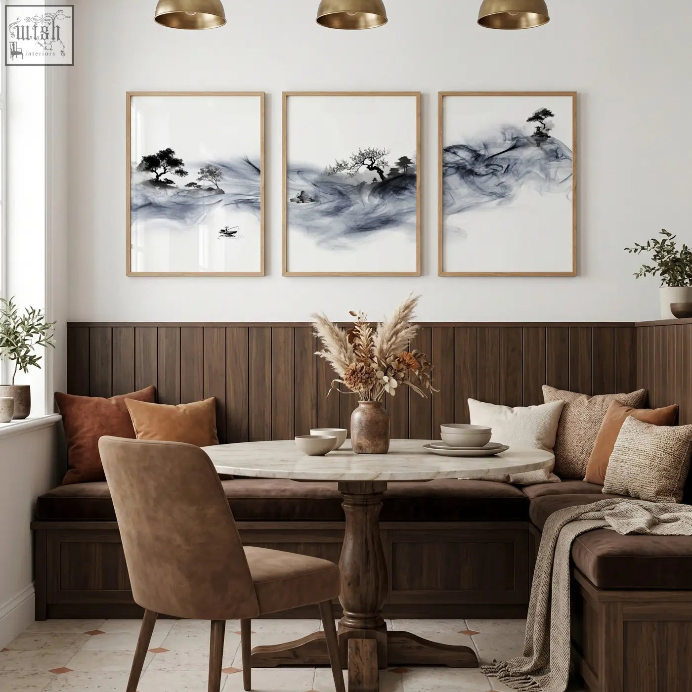 Round marble-top dining room table with dark wood pedestal base paired with blue japandi ink wash wall art set of 3