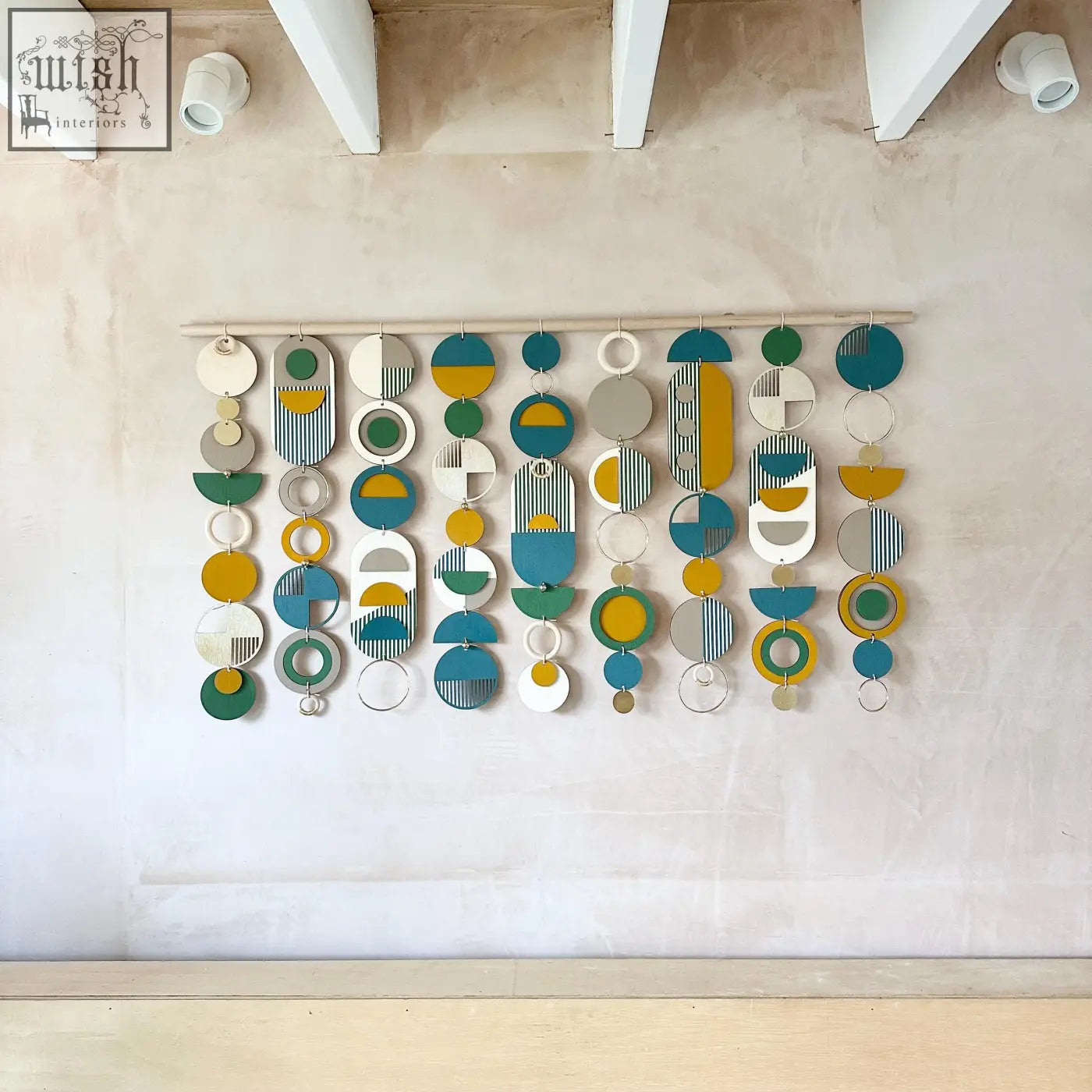 Large wall art wood geometric wall hanging with teal mustard green white and gray stripes for over the bed decor