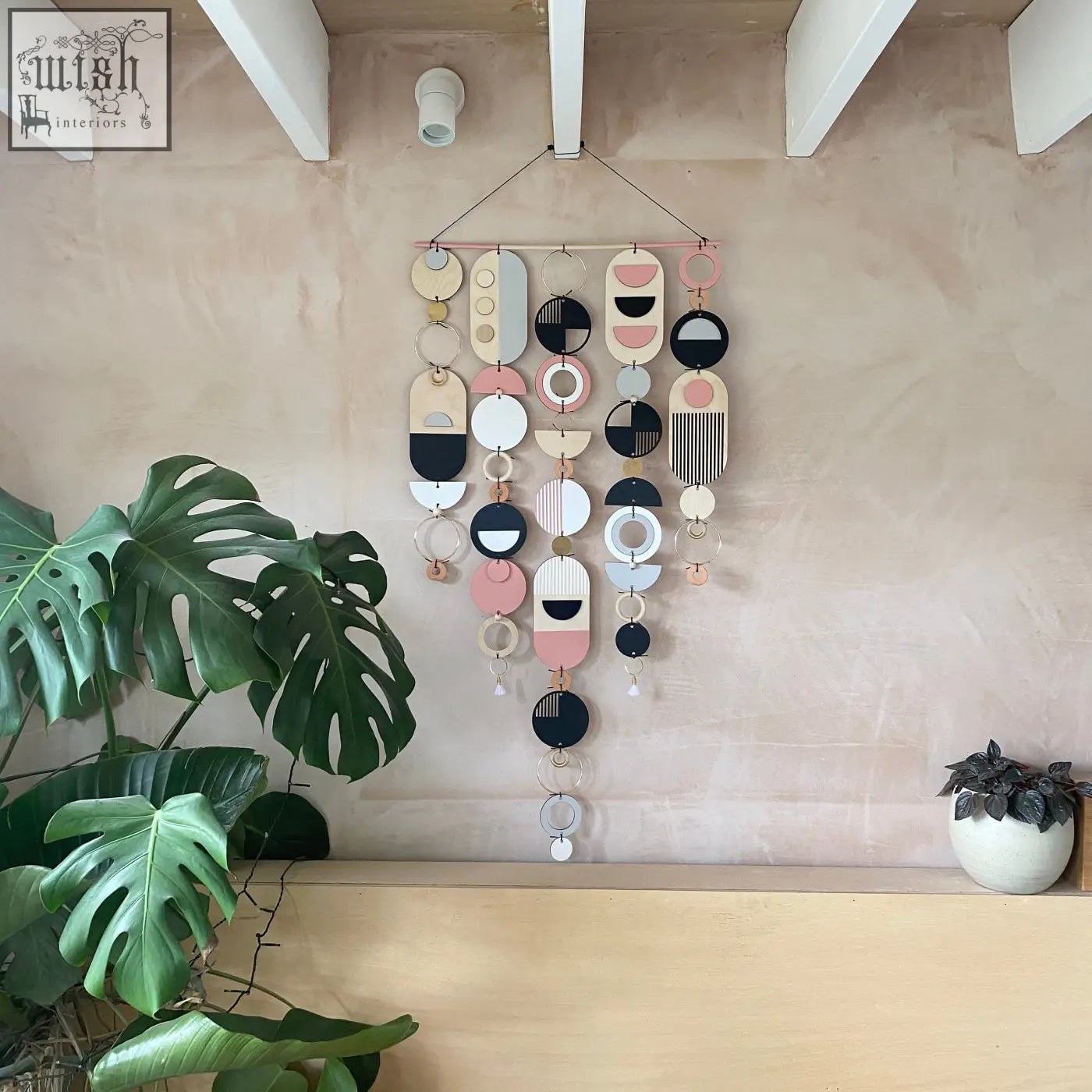 Large wall art pink geometric artwork with layered circles in pastel pink black white and natural wood tones
