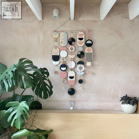 Large wall art pink geometric artwork with layered circles in pastel pink black white and natural wood tones