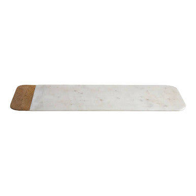 A large white marble serving board with subtle gray veins and a mango wood cork edge by monzaro