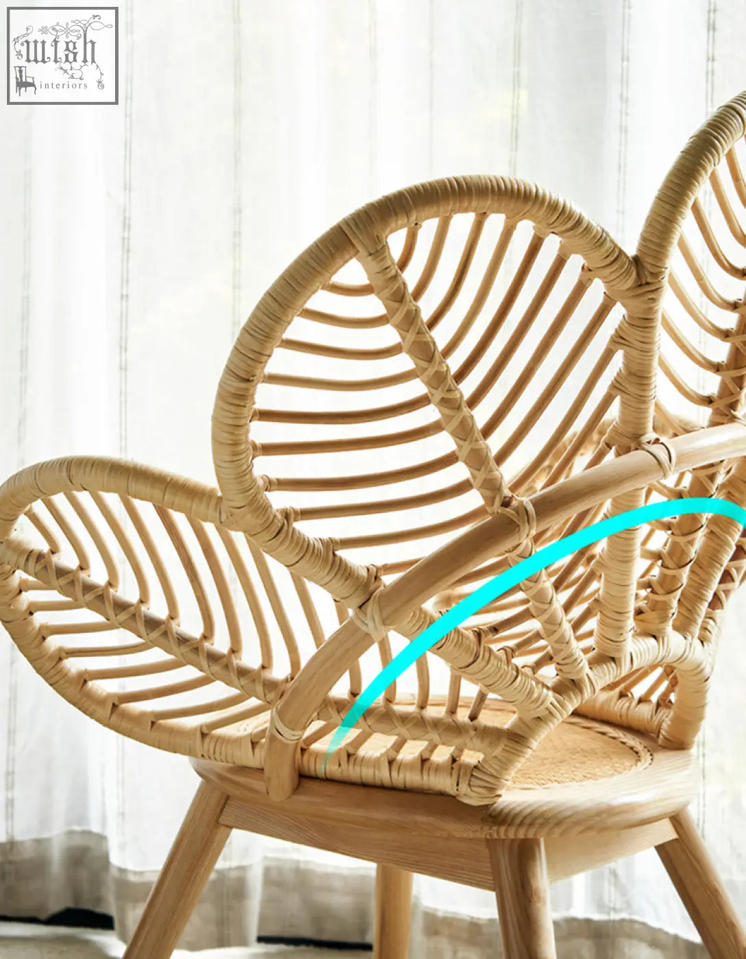 A light beige rattan larkin lounge chair with a curved petal backrest offering tropical elegance and financing options