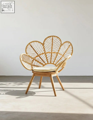 Larkin lounge chair light brown rattan armchair with leaf-shaped back cream cushion offering tropical elegance and financing
