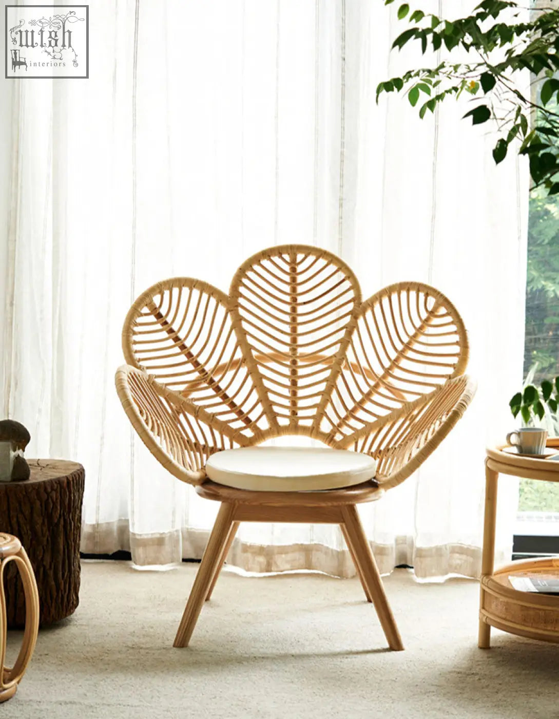 Larkin lounge chair armchair rattan with light brown leaf-shaped back wooden legs and white cushion offers tropical elegance