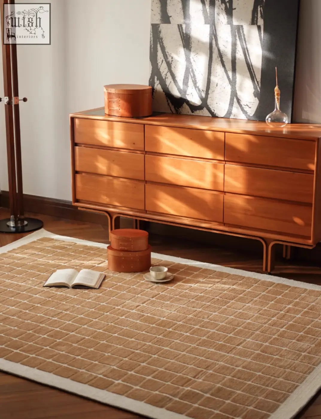 Beige woven lattice living room rug with grid pattern and white border perfect for coffee table set area