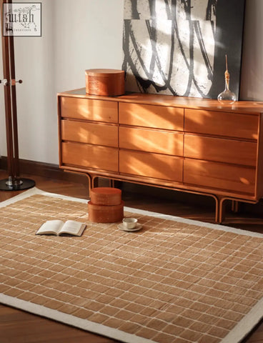 Beige woven lattice living room rug with grid pattern and white border perfect for coffee table set area
