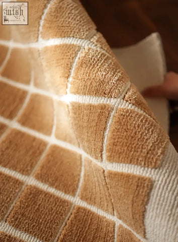 Tan and white geometric patterned lattice living room rug with plush texture perfect for coffee table set or table set