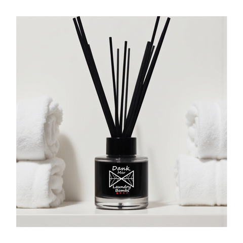 Black glass laundry bombs single diffuser with sleek minimalist design and fragrance oil label from dank mer laundry bombs