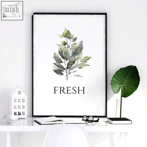 Black-framed laundry room art prints featuring green leaf watercolor and fresh text perfect for laundry room decor