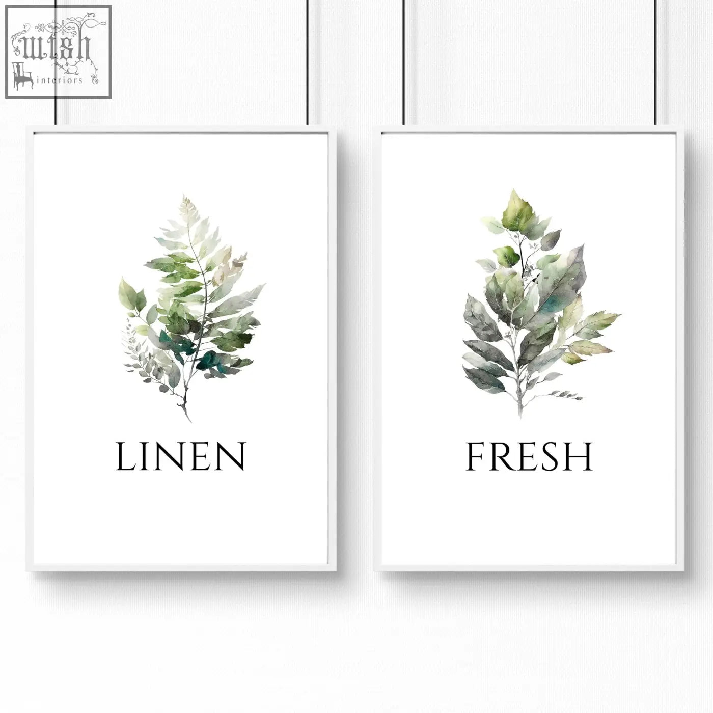 Two framed laundry room art prints featuring watercolor leaf illustrations in soft green and gray tones with white frames
