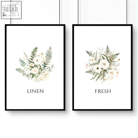 Two framed botanical laundry room pictures with watercolor white flowers and green ferns in black frames wall art prints