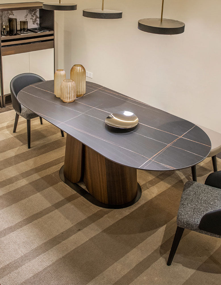 Modern lauren dining table with dark gray sintered stone top and sleek cylindrical wooden base