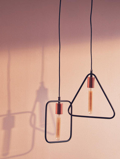 Lavis black and copper finish pendant light with black metal geometric design and copper finish pendant accents and exposed bulbs