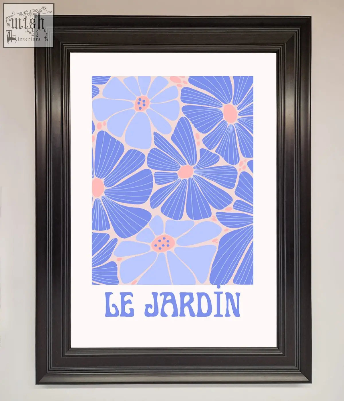 A jardin blue framed poster with stylized blue and pink flowers and le jardin text in a sleek black frame