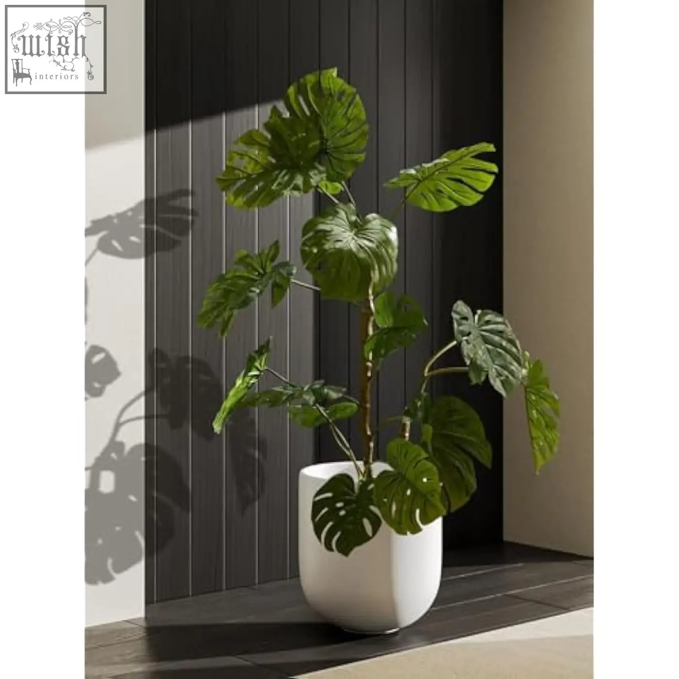 A lush monstera in a white ceramic le tauci 30 cm plant pot with drainage hole perfect for indoor plants