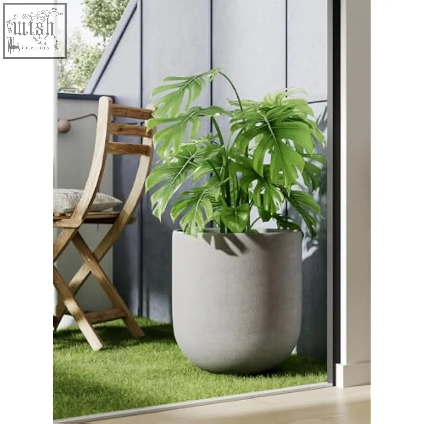 A lush green monstera thriving in a grey ceramic large plant pot perfect for indoor plants and home garden decor