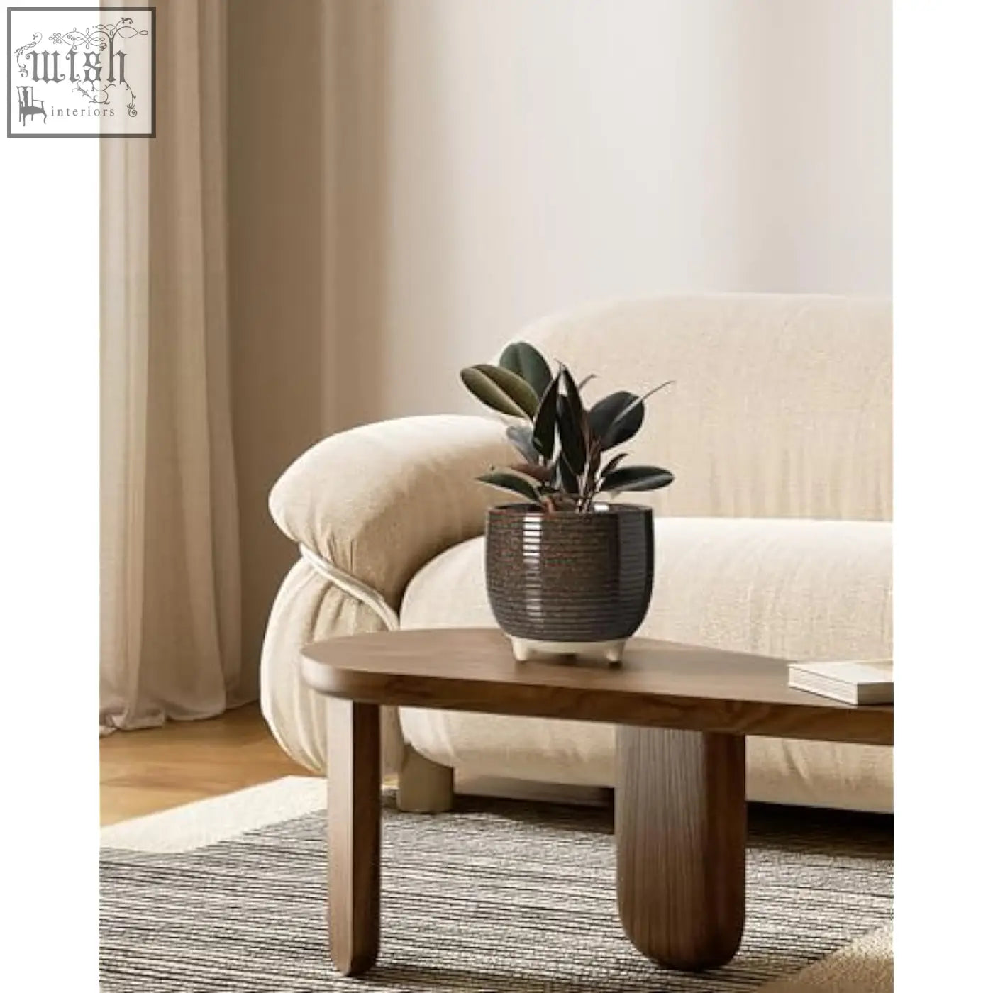 A dark gray ribbed ceramic plant pot with matte finish holding a ficus elastica perfect for indoor use