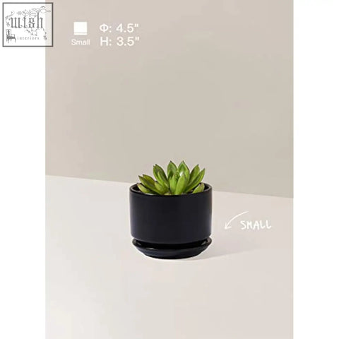 Black ceramic planter with matching saucer holding a green succulent featuring mesh pad and drainage hole ceramic pots
