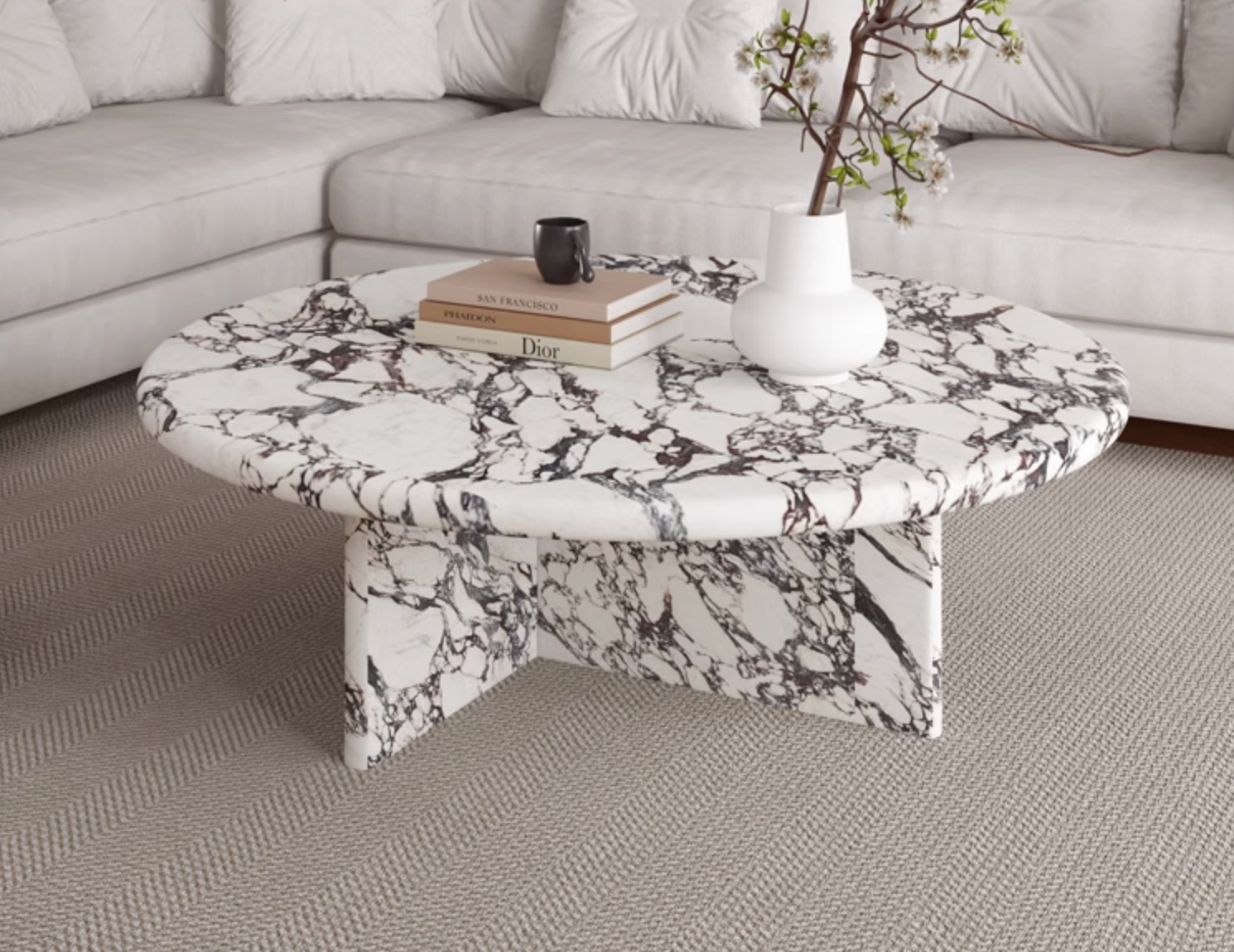 Leanna coffee table with a sleek round coffee table design featuring black and white marble top and pedestal base