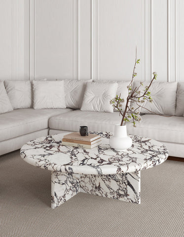 Leanna coffee table with sleek oval white and black marble top and matching pedestal base perfect as a round coffee table