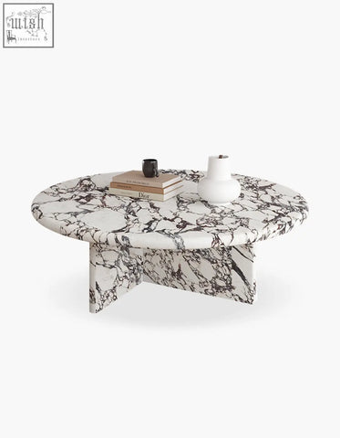Leanna coffee table with sleek oval white and black marble top and matching sculpted legs perfect as a round coffee table
