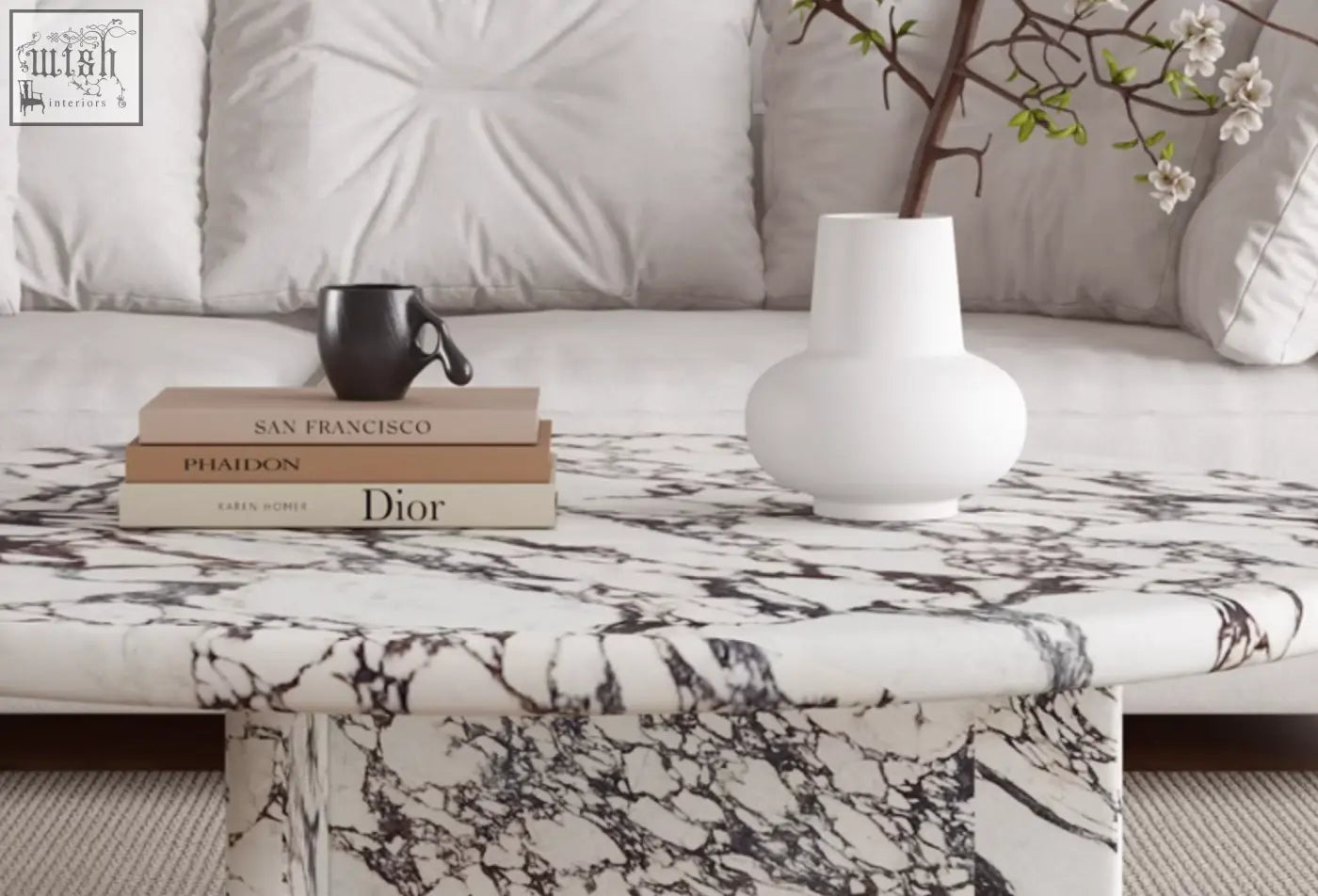 Leanna coffee table round coffee table made of white marble with black veining and sleek modern design