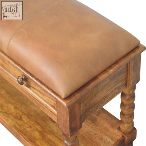 Tan leather spindle bench with wooden turned legs and built-in drawer for stylish seating and storage