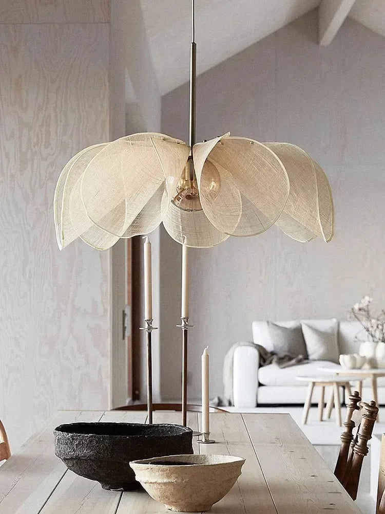 Beige led flower pendant light with petal-shaped shade and slender metallic stem for living room lighting