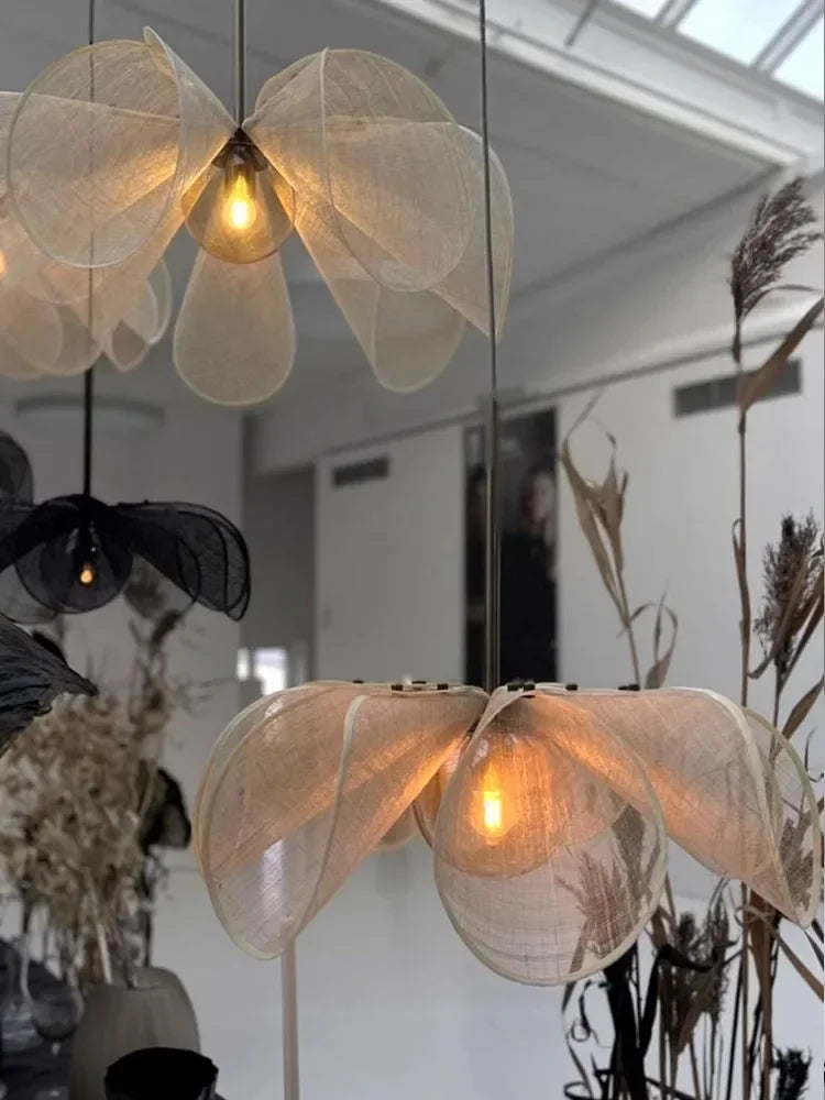 Delicate cream-colored led flower pendant light with warm glowing bulbs perfect for living room pendant light