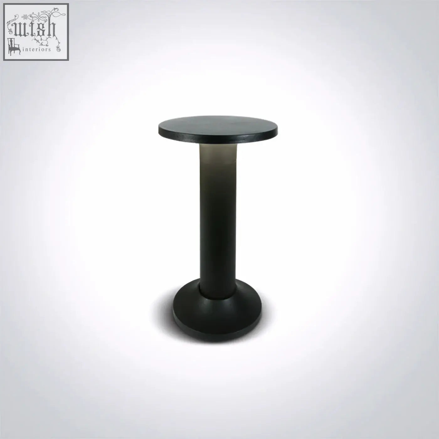 Black round table with sleek matte pedestal base paired with led mushroom bollards en60598-1 design