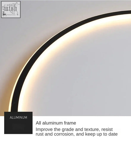 Modern curved ring flush mount led light fixture with sleek black aluminum frame and warm ambient glow