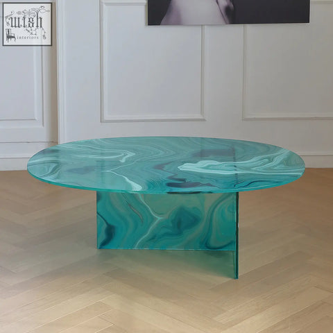 Leila coffee table with a sleek oval glass coffee table top and matching turquoise marbled base in green
