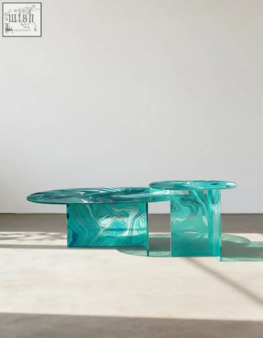 Leila coffee table in teal translucent acrylic with marbled patterns perfect as a green glass coffee table or round nesting piece