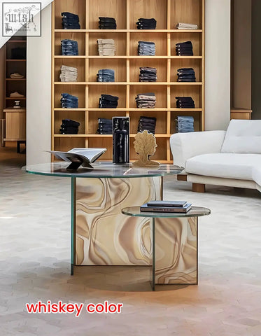 Whiskey-colored glass coffee table and matching side table with marbleized base in green round nesting style
