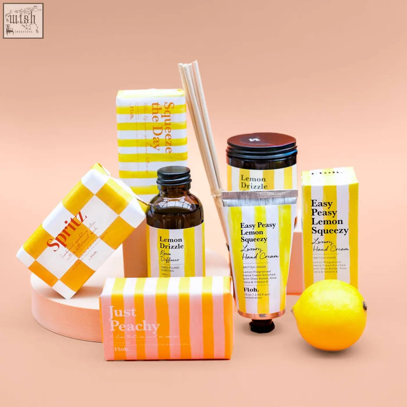 A vibrant yellow lemon with glossy skin highlights the natural vegetable soy wax in the lemon drizzle apothecary candle